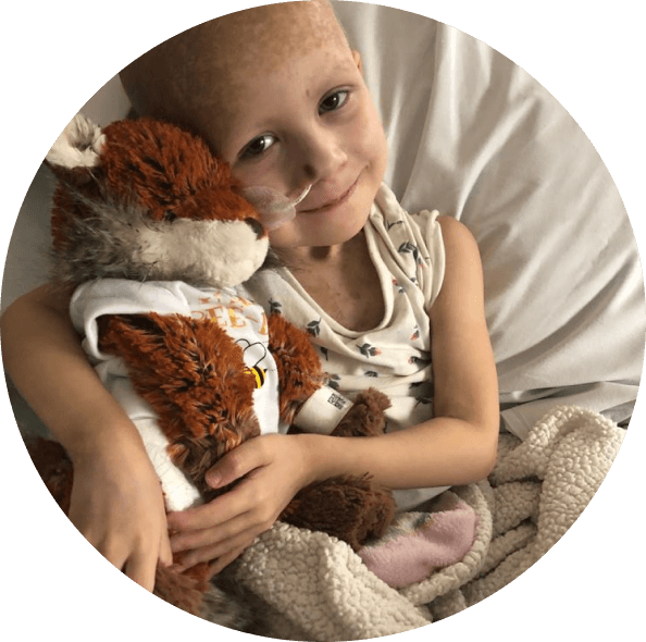Photo of Beau cuddling her teddy